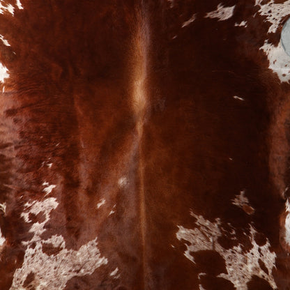 Close up of Brown and white nguni cowhide rug