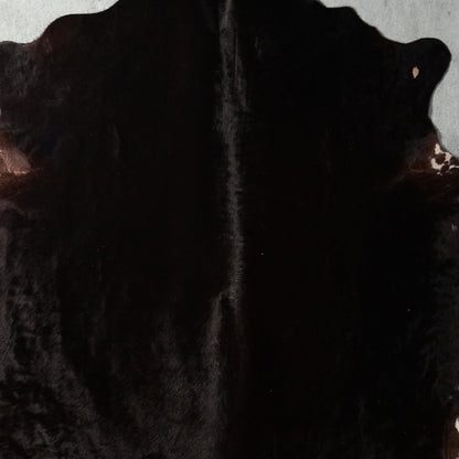 A close up of a black Nguni cowhide rug 