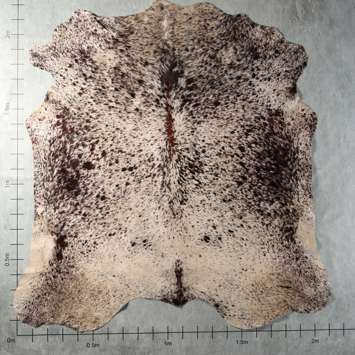 Genuine South African Nguni hide AAS8321 in cream with dense dark brown speckled markings.