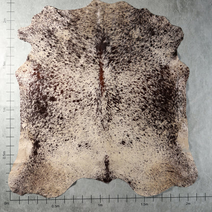 Genuine South African Nguni hide AAS8321 in cream with dense dark brown speckled markings.