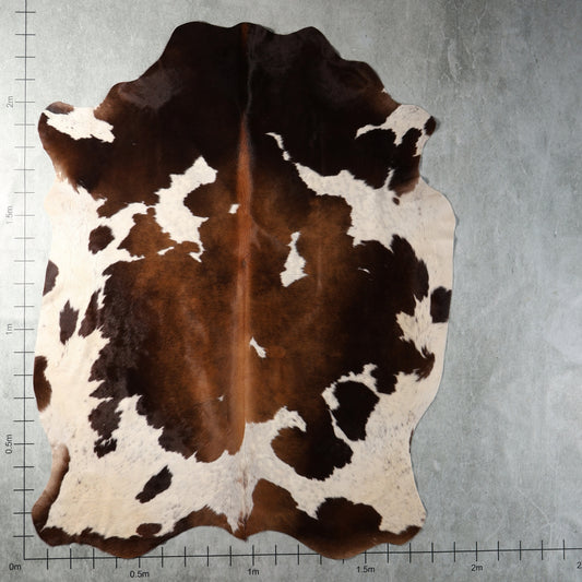 Dark brown, chestnut and white genuine South African Nguni cowhide AAS8324 with bold irregular patches.