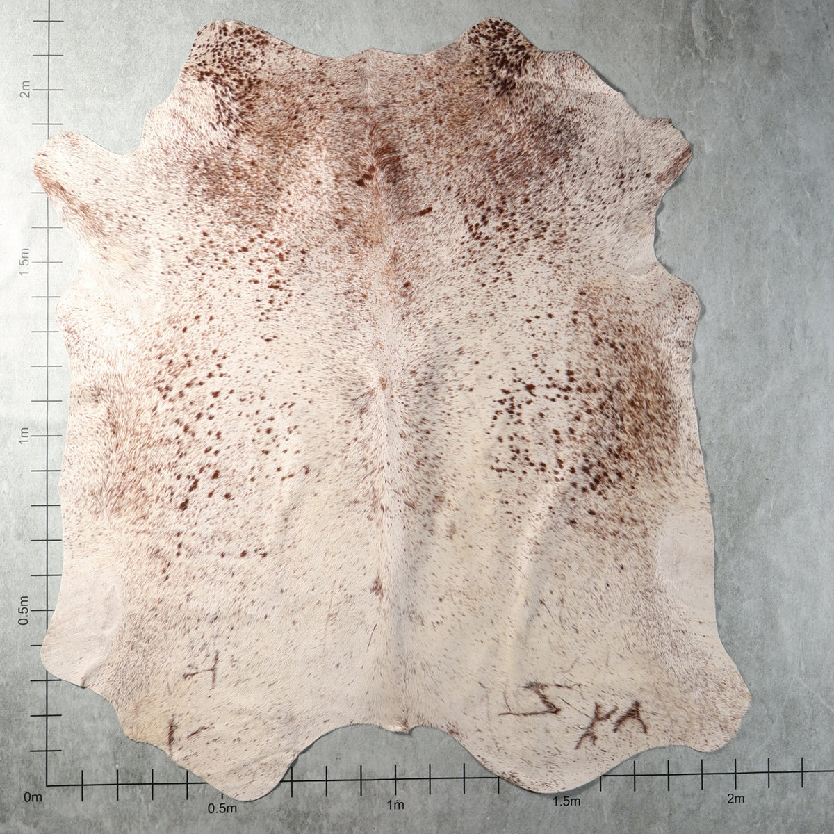 Genuine South African Nguni hide AAS8325 in cream with delicate light brown speckled markings.