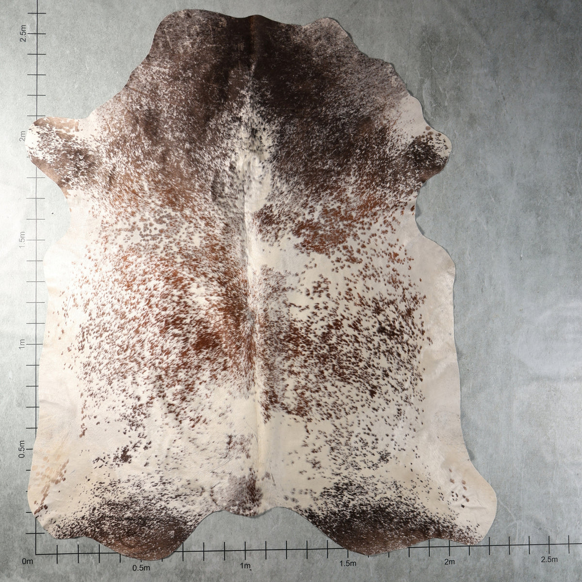 Genuine South African Nguni hide AGS7412 in dark brown and cream with dense chestnut speckling and contrasting natural markings.