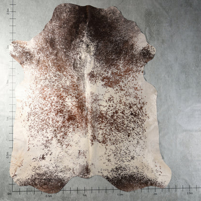 Genuine South African Nguni hide AGS7412 in dark brown and cream with dense chestnut speckling and contrasting natural markings.