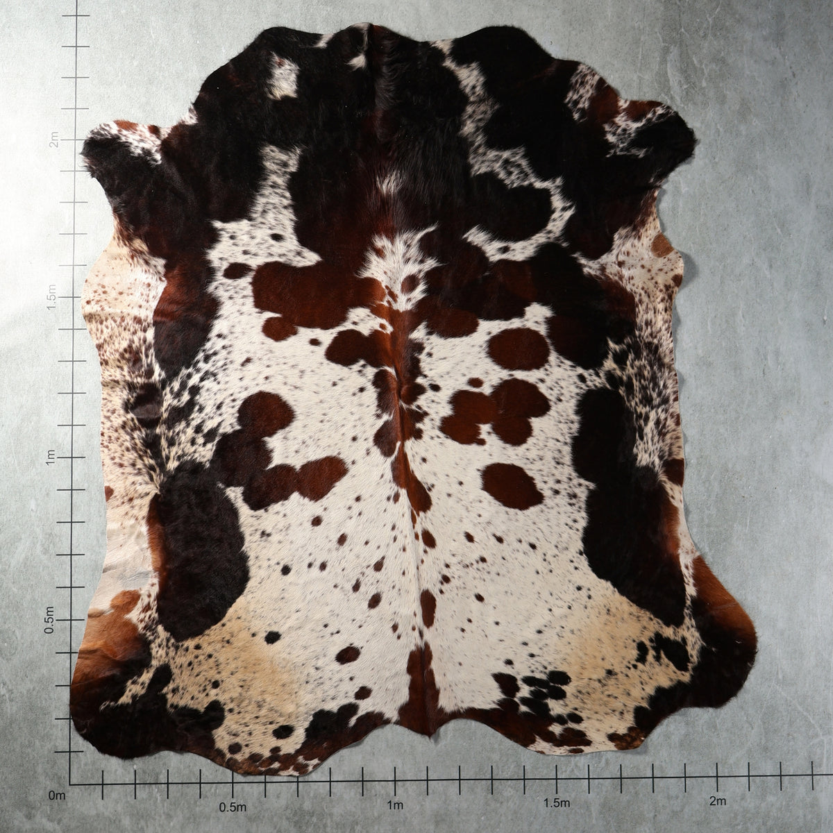 Genuine South African tri colour Nguni hide in black, brown and white with speckled markings – TRI2846